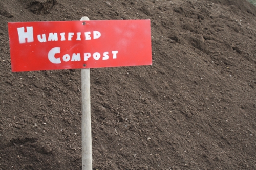sign says humified compost stuck in mound
